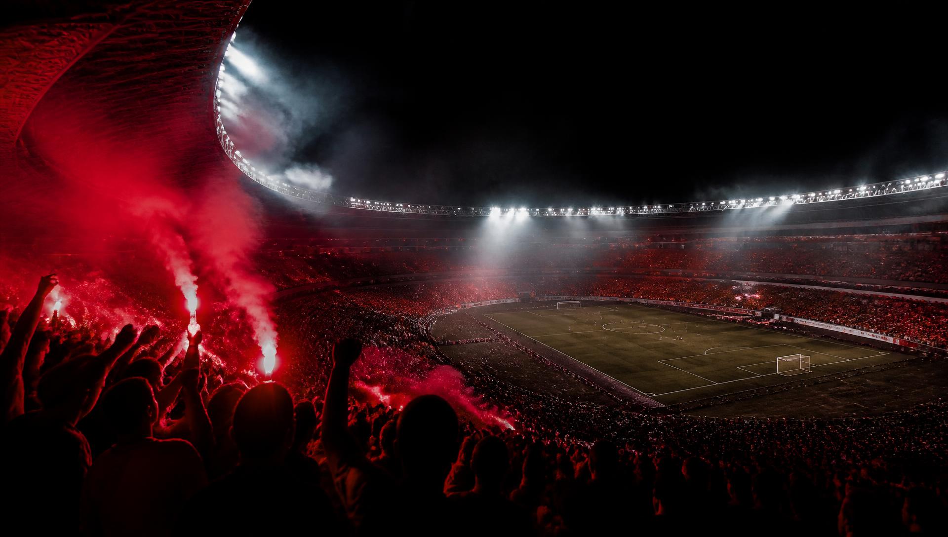 Floodlit stadium at night